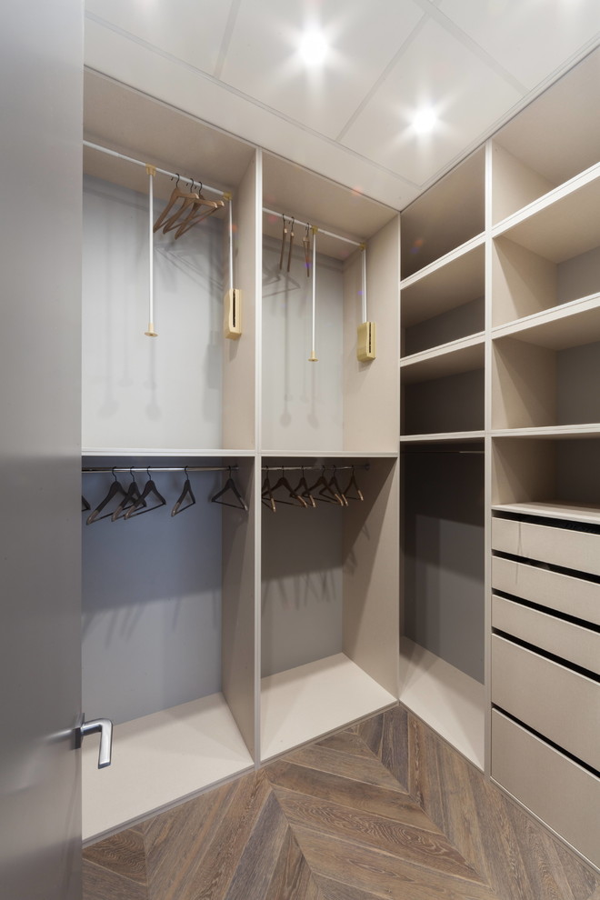 Design ideas for a contemporary storage and wardrobe in Moscow with open cabinets and grey cabinets.