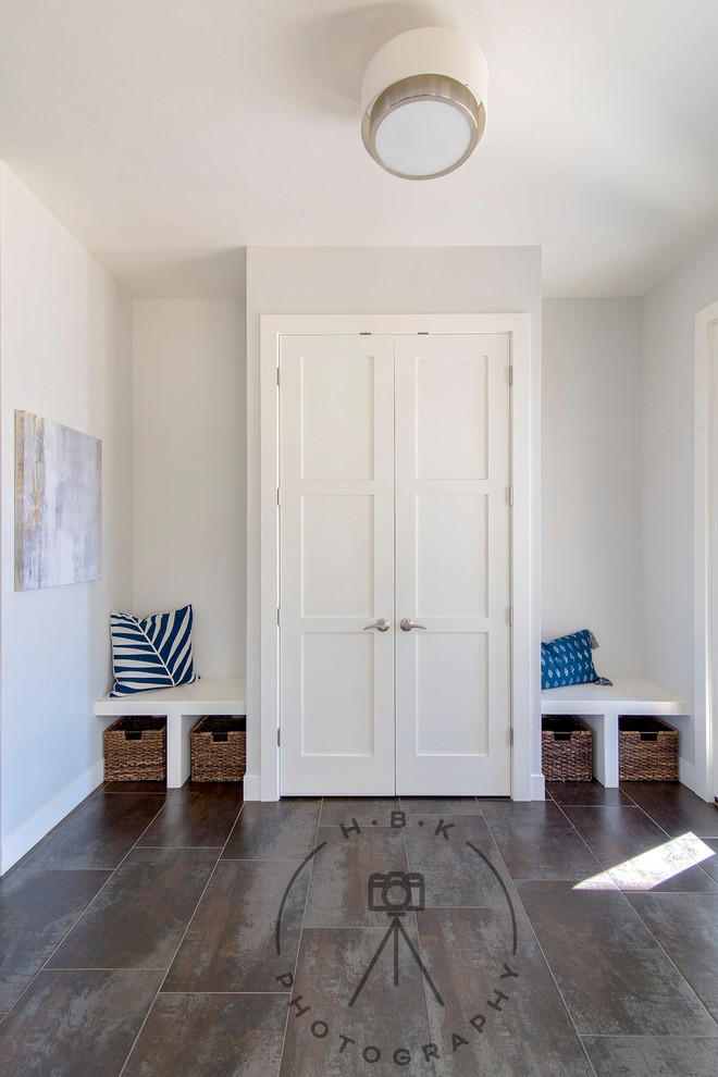 Inspiration for a mid-sized ceramic tile and gray floor foyer remodel with gray walls