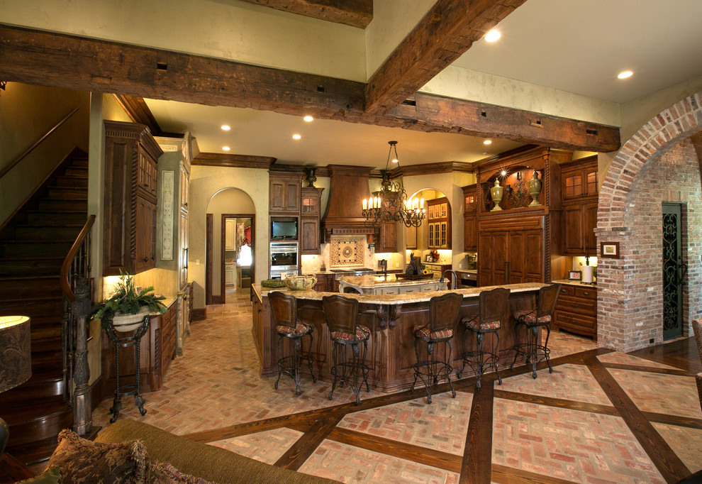 Photo of a mediterranean kitchen in New Orleans with brick floors.