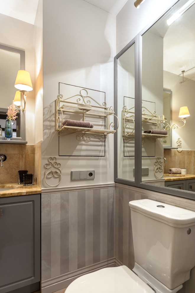 Small traditional bathroom in Moscow with grey cabinets, ceramic tile, porcelain floors, marble benchtops, beige floor, yellow benchtops, a two-piece toilet, raised-panel cabinets, white walls and an undermount sink.