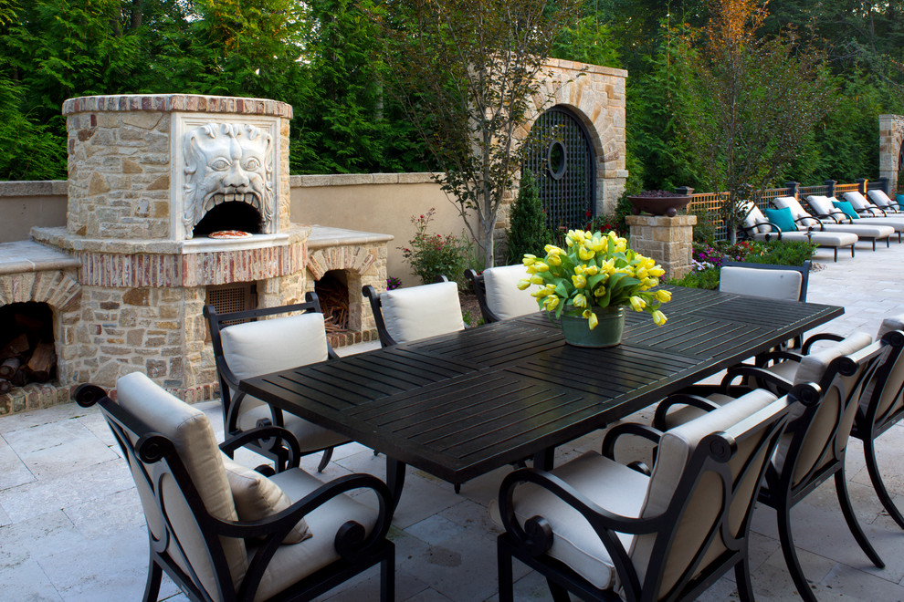 This is an example of a mediterranean patio in DC Metro with a fire feature and no cover.