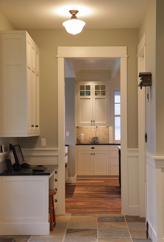 Inspiration for a traditional hallway in Seattle with grey walls and dark hardwood floors.