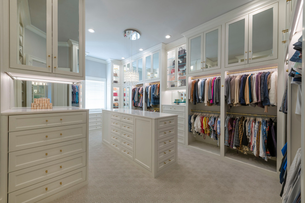 Large transitional gender-neutral walk-in wardrobe in Dallas with beaded inset cabinets, white cabinets, carpet and grey floor.