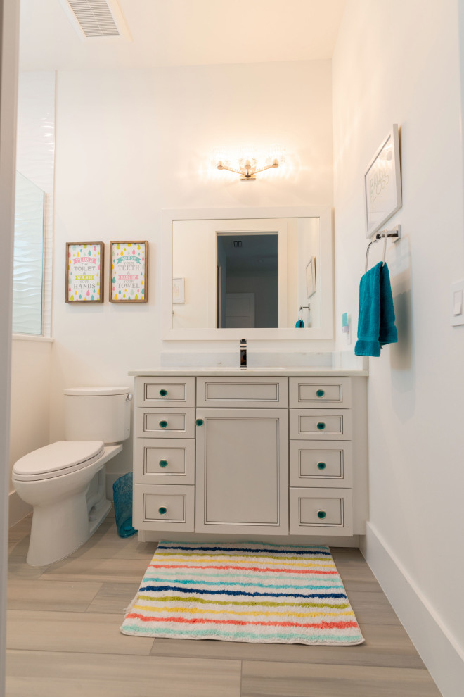 Photo of a medium sized modern family bathroom in Miami with white cabinets, a built in vanity unit, a walk-in shower, a two-piece toilet, white walls, wood-effect flooring, a submerged sink, beige floors, a hinged door and a single sink.