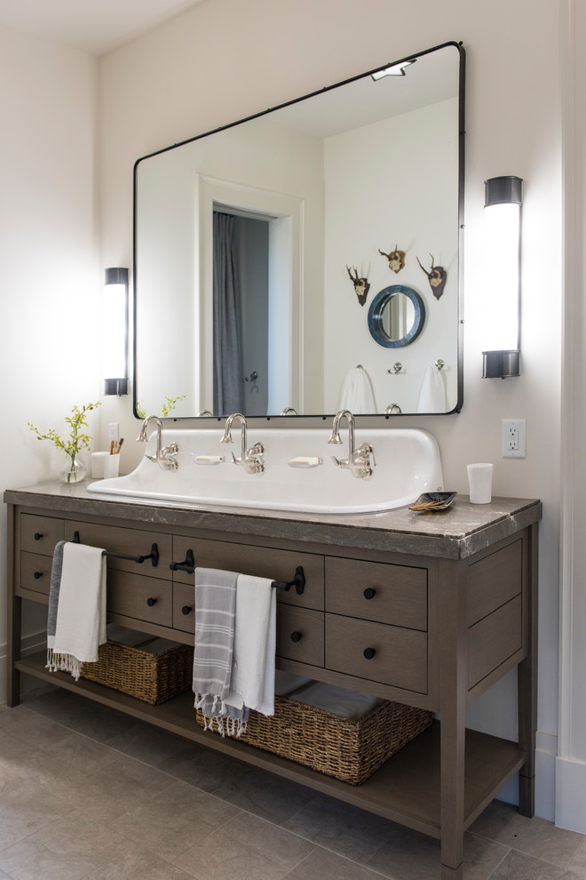 This is an example of a traditional 3/4 bathroom in Salt Lake City with brown cabinets, white walls, a trough sink, grey floor, grey benchtops and flat-panel cabinets.