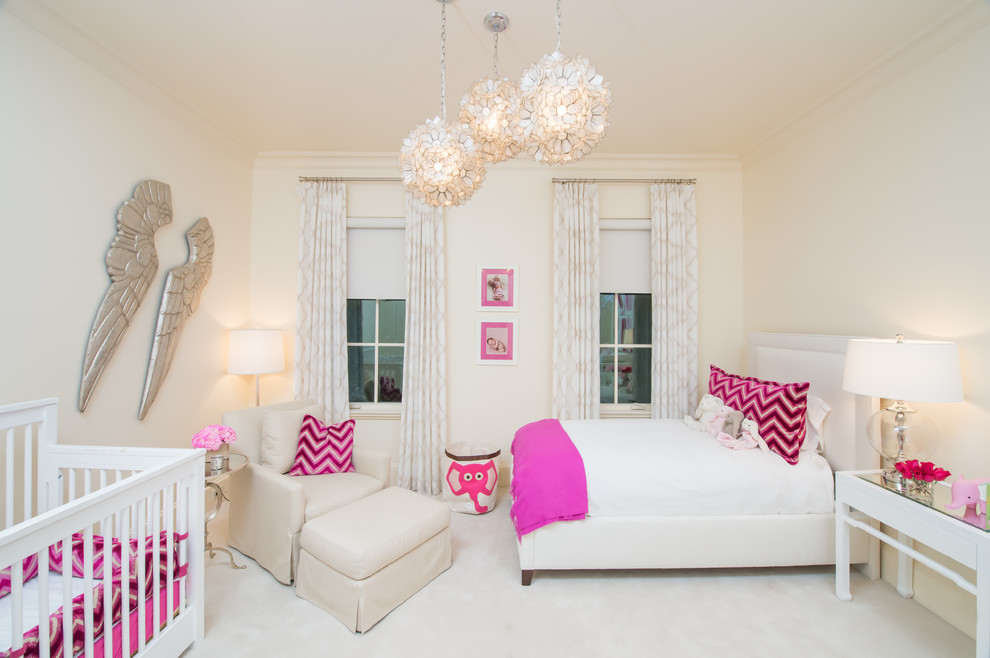 This is an example of a mid-sized transitional nursery for girls in Dallas with beige walls and carpet.