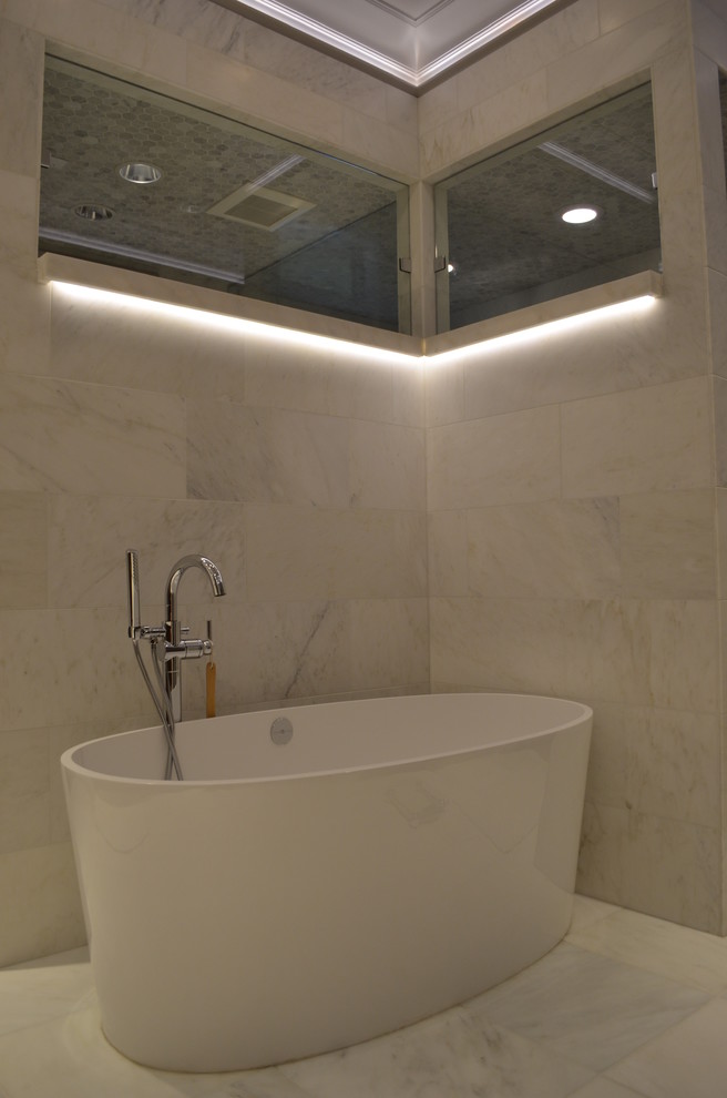 Inspiration for a large contemporary bathroom in Charlotte with marble benchtops, a freestanding tub, white tile, stone tile, white walls, marble floors, with a sauna, shaker cabinets, dark wood cabinets and an undermount sink.