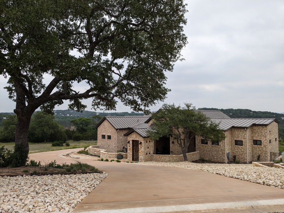 House with hill country beyond