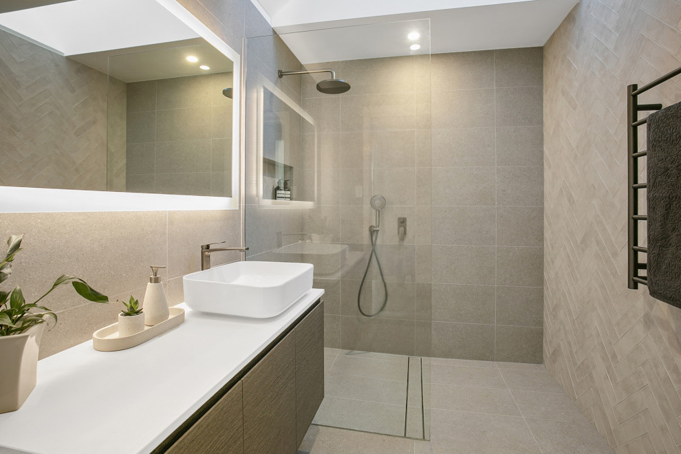 Mid-sized contemporary bathroom in Sydney with medium wood cabinets, an open shower, beige tile, porcelain tile, a vessel sink, engineered quartz benchtops and white benchtops.