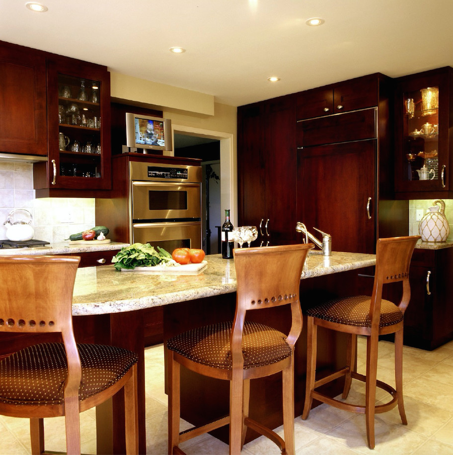 Example of a mid-sized transitional u-shaped porcelain tile and beige floor eat-in kitchen design in Toronto with an undermount sink, shaker cabinets, dark wood cabinets, granite countertops, gray backsplash, ceramic backsplash, paneled appliances and an island