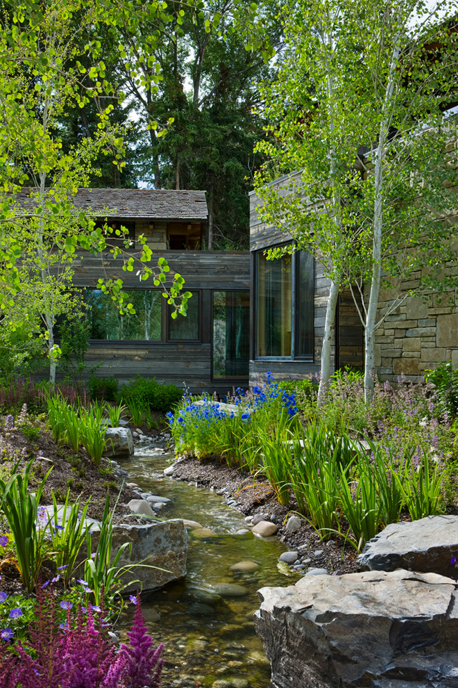 This is an example of a country garden in Salt Lake City with a water feature.