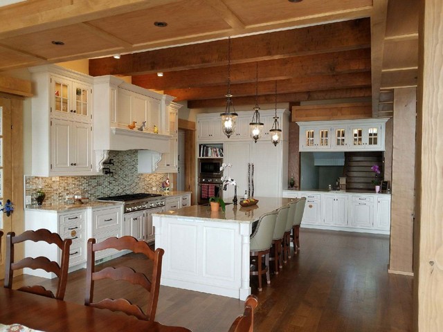 Traditional Kitchen With White Cabinets And Lighted Upper Cabinets