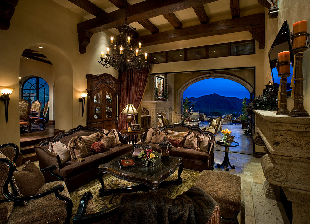 Design ideas for an expansive formal open concept living room in Phoenix with beige walls, travertine floors, a standard fireplace, a stone fireplace surround, a wall-mounted tv, multi-coloured floor and exposed beam.