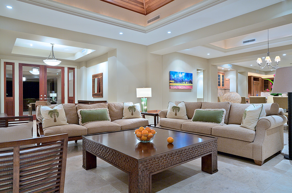 Inspiration for a tropical open concept living room in Hawaii with beige walls.