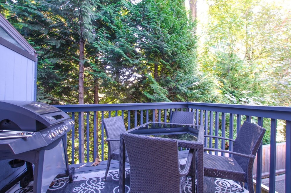 Water fountain deck - large rustic backyard water fountain deck idea in Vancouver with no cover