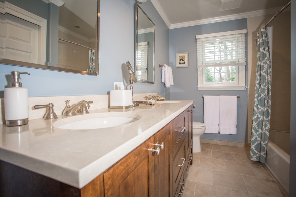 Alcove bathtub - mid-sized transitional beige tile and porcelain tile porcelain tile alcove bathtub idea in DC Metro with an undermount sink, flat-panel cabinets, dark wood cabinets, quartz countertops, a two-piece toilet and blue walls
