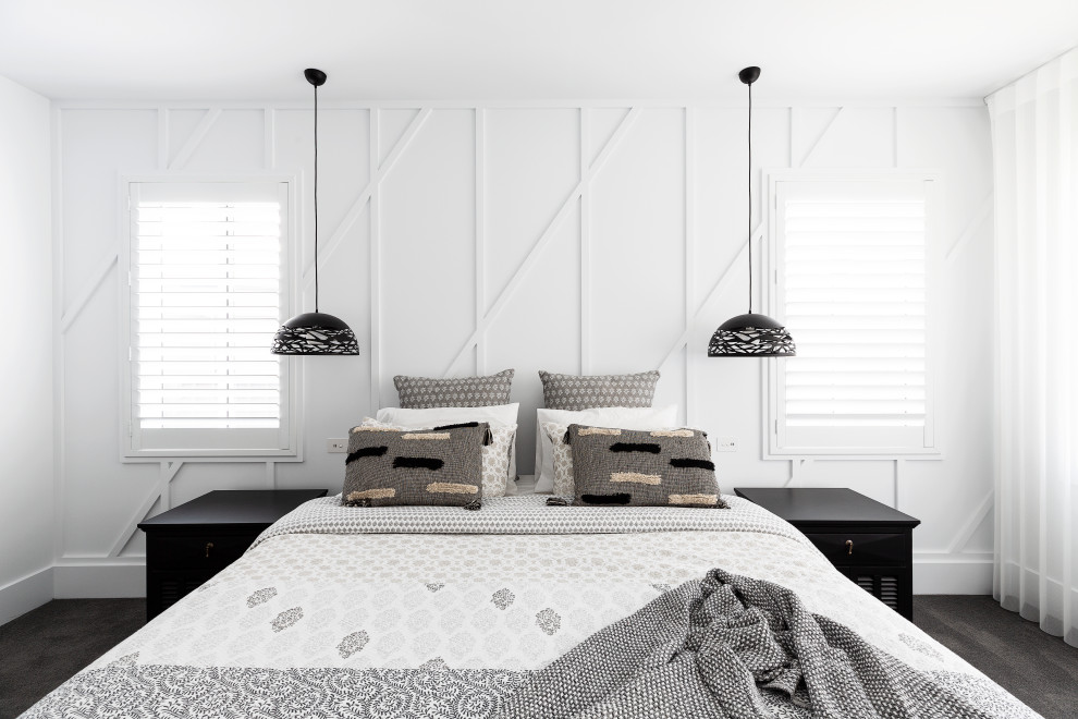 Design ideas for a mid-sized beach style guest bedroom in Sydney with white walls, carpet, grey floor and decorative wall panelling.