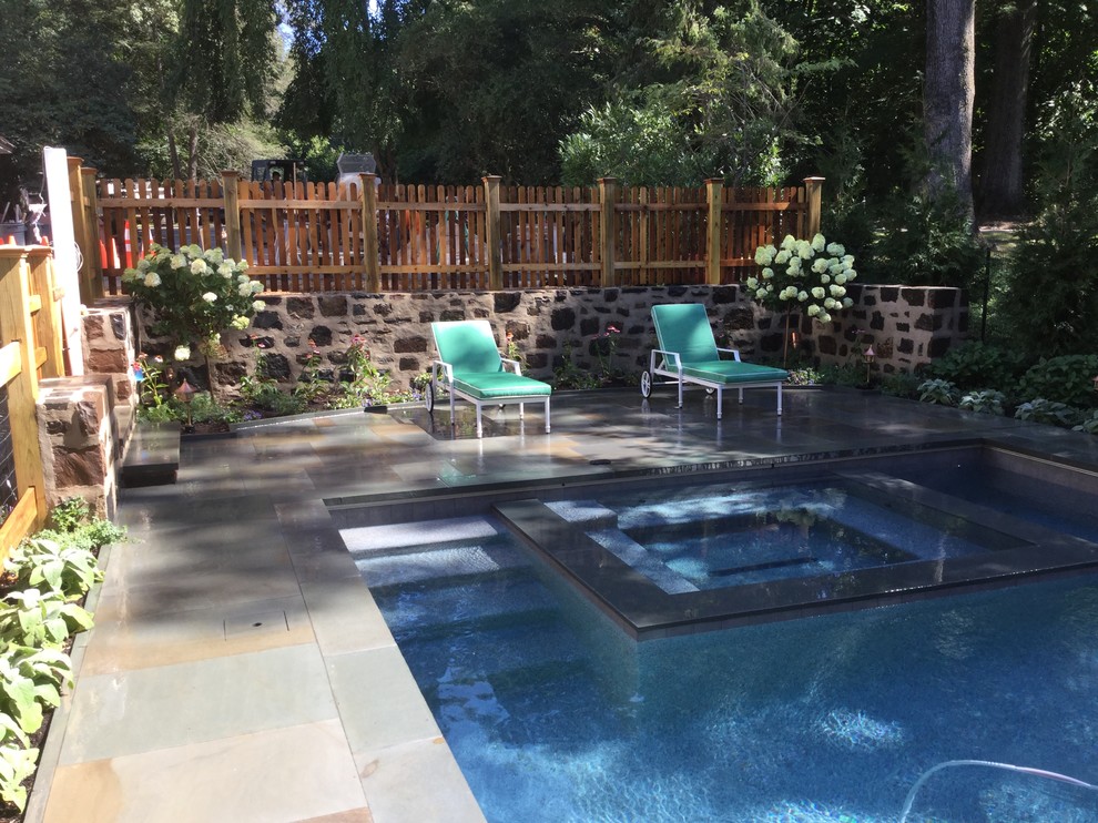 Inspiration for a large country backyard rectangular lap pool in Philadelphia with a hot tub and concrete pavers.