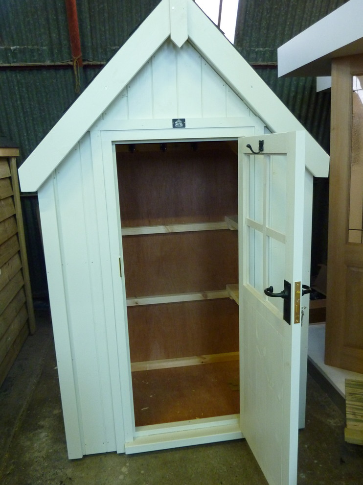 This is an example of a small modern detached garden shed in Other.