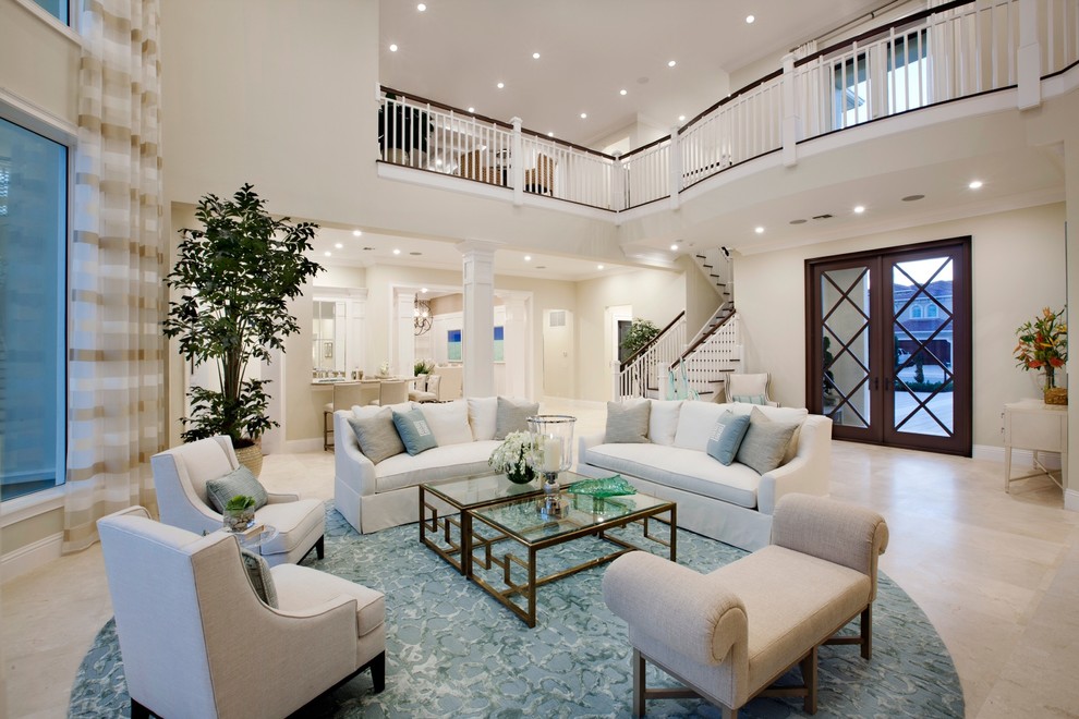 Photo of a large tropical formal open concept living room in Miami with white walls and marble floors.