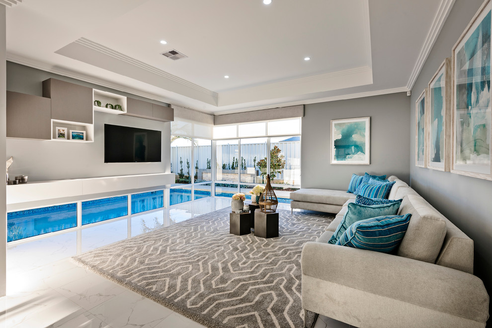 This is an example of a large contemporary open concept family room in Perth with white walls, porcelain floors, a built-in media wall and white floor.