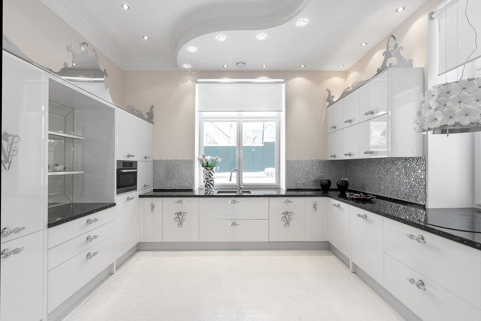 Photo of a traditional u-shaped kitchen in Other with a double-bowl sink, flat-panel cabinets, white cabinets, grey splashback, stainless steel appliances and no island.