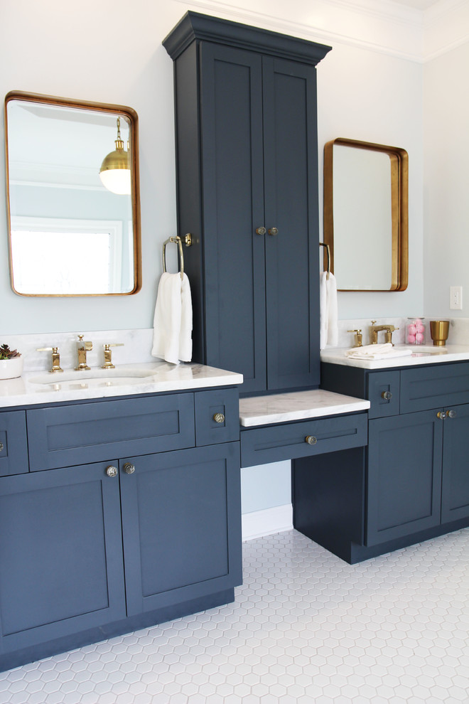 This is an example of a large traditional master bathroom in Atlanta with shaker cabinets, blue cabinets, a claw-foot tub, a two-piece toilet, white tile, subway tile, blue walls, mosaic tile floors, an undermount sink and quartzite benchtops.