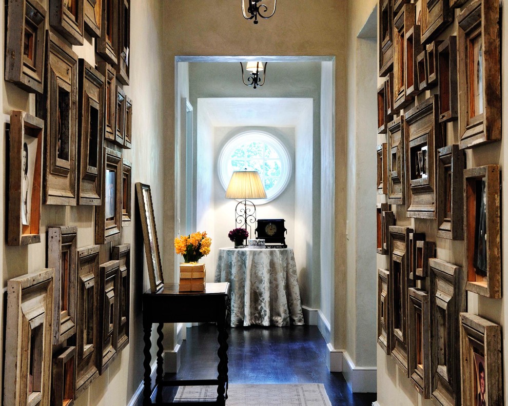 Inspiration for a traditional hallway in Atlanta with beige walls and dark hardwood floors.