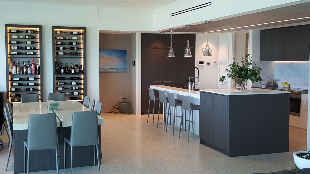 Photo of a mid-sized modern galley open plan kitchen in Perth with with island.