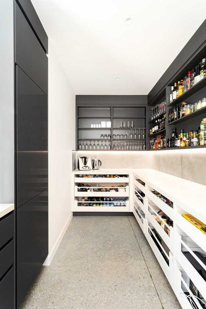 Design ideas for a contemporary l-shaped kitchen pantry in Brisbane with open cabinets, black cabinets, cement tile splashback, no island, grey floor and white benchtop.