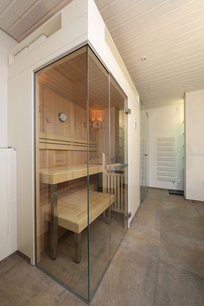 This is an example of a traditional bathroom in Other with with a sauna.