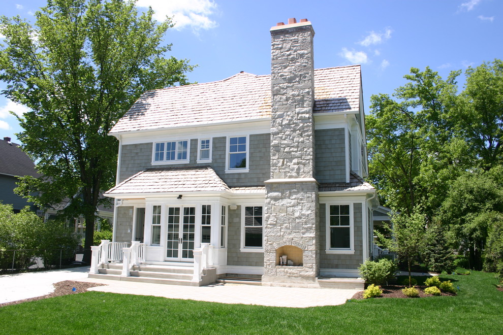 Photo of a beach style exterior in Chicago with stone veneer.