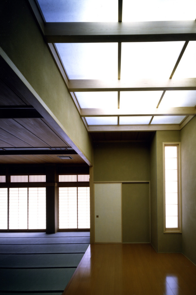 Photo of a large world-inspired formal open plan living room in Other with brown walls, tatami flooring, no fireplace, no tv, green floors and a wood ceiling.