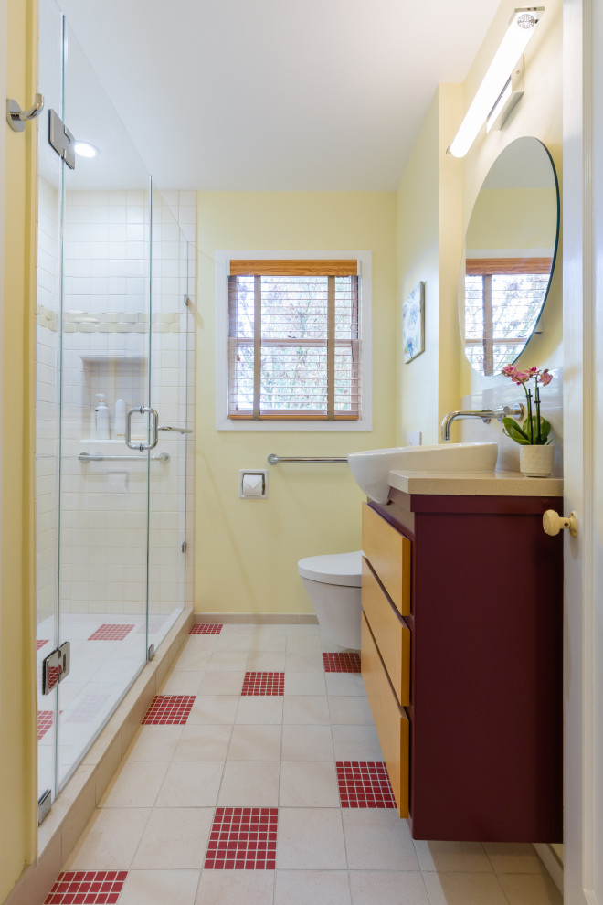 This is an example of a small midcentury bathroom in San Francisco with flat-panel cabinets, red cabinets, a wall mounted toilet, white tiles, ceramic tiles, yellow walls, porcelain flooring, a vessel sink, engineered stone worktops, beige floors, a hinged door, beige worktops, a wall niche, a single sink and a floating vanity unit.