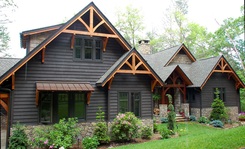 Photo of a traditional exterior in Other with wood siding and a gable roof.