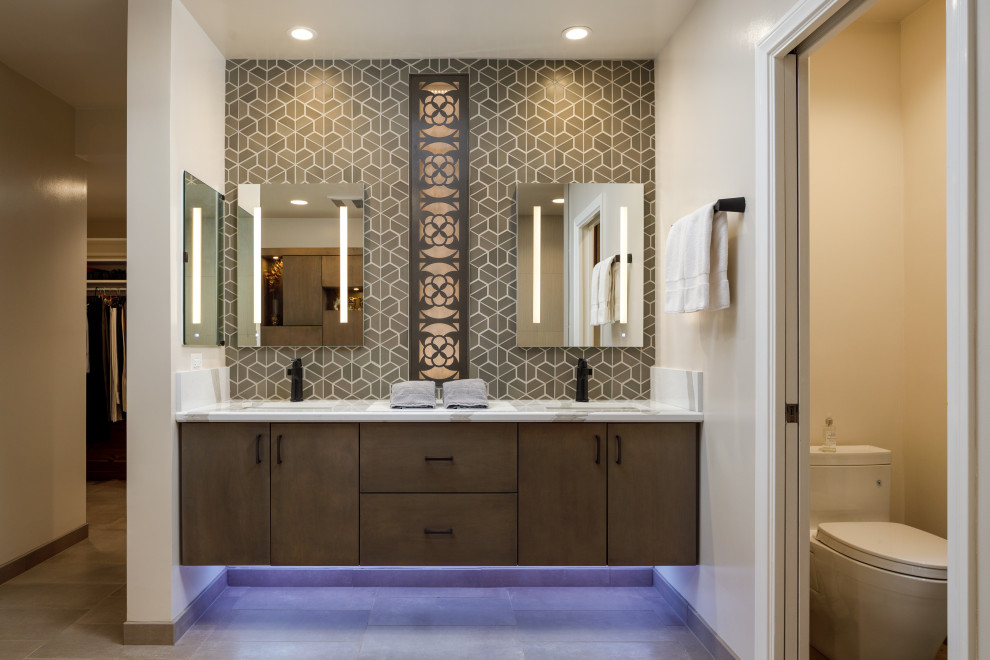 Design ideas for a large contemporary master bathroom in Orange County with flat-panel cabinets, brown cabinets, a hot tub, a curbless shower, a two-piece toilet, brown tile, porcelain tile, beige walls, porcelain floors, an undermount sink, engineered quartz benchtops, brown floor, an open shower, white benchtops, a shower seat, a double vanity and a floating vanity.