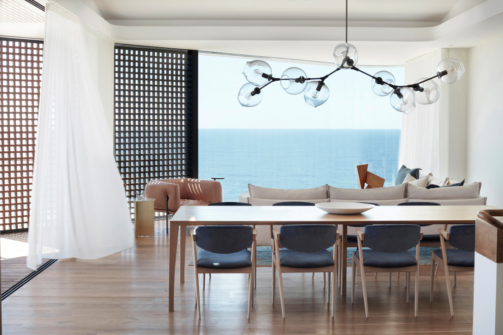 Beach style dining room in Sydney.