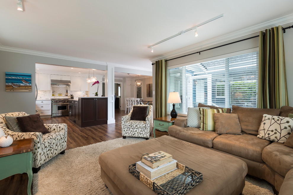 Example of a mid-sized transitional l-shaped medium tone wood floor open concept kitchen design in Vancouver with an undermount sink, shaker cabinets, white cabinets, quartz countertops, white backsplash, stone tile backsplash, stainless steel appliances and an island
