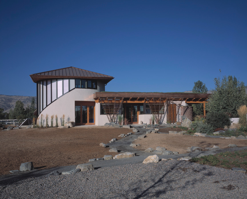 Inspiration for a huge modern white two-story stucco exterior home remodel in Denver