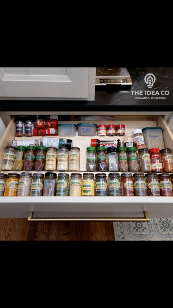 Mid-sized transitional galley light wood floor and brown floor kitchen pantry photo with a single-bowl sink, recessed-panel cabinets, white cabinets, quartzite countertops, multicolored backsplash, ceramic backsplash, stainless steel appliances, an island and white countertops