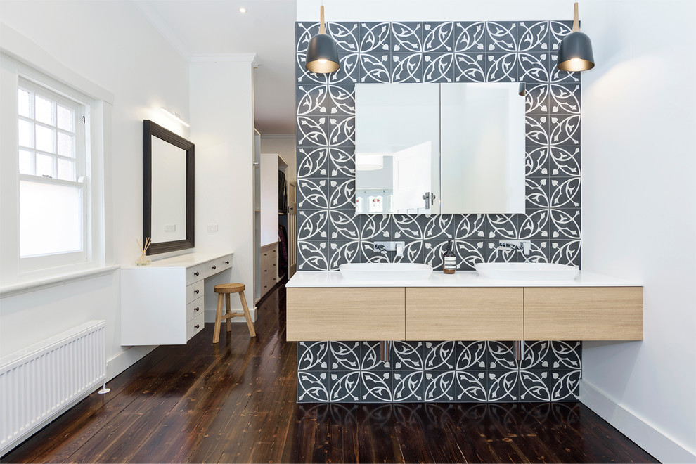 Large contemporary master bathroom in Melbourne with flat-panel cabinets, light wood cabinets, an alcove shower, a one-piece toilet, black and white tile, ceramic tile, white walls, dark hardwood floors, an integrated sink and engineered quartz benchtops.
