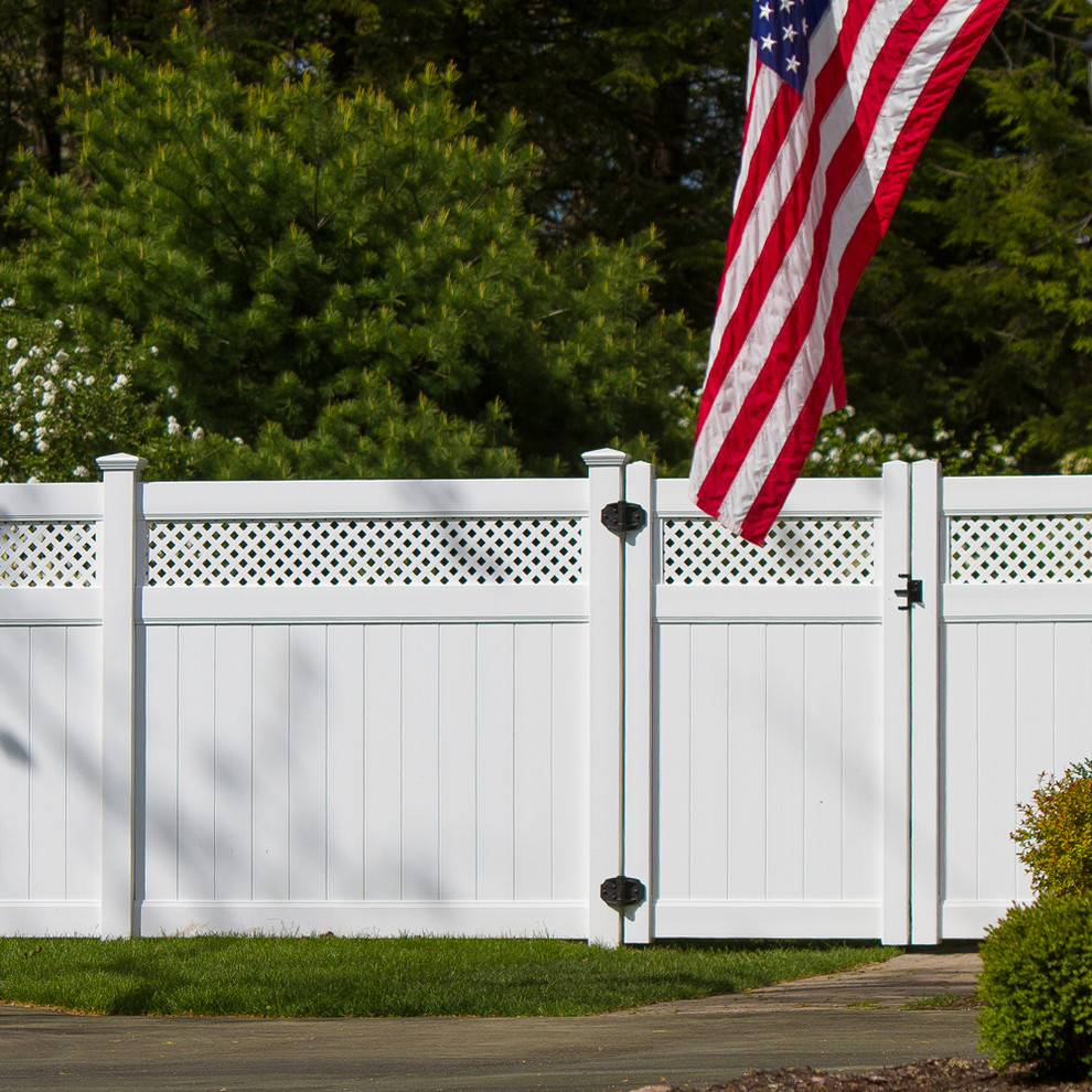 Photo of a traditional garden in Boston with a vinyl fence.