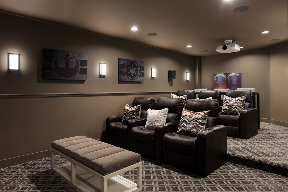 Photo of a small contemporary enclosed home theatre in Grand Rapids with brown walls, carpet, a projector screen and grey floor.