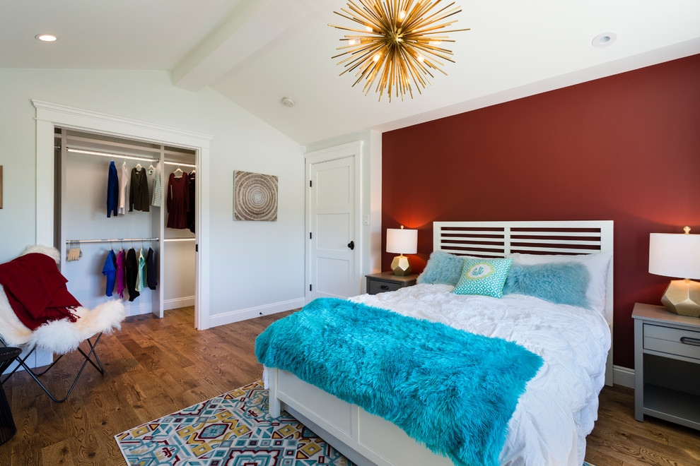 Inspiration for a mid-sized transitional bedroom in Vancouver with red walls, medium hardwood floors and brown floor.