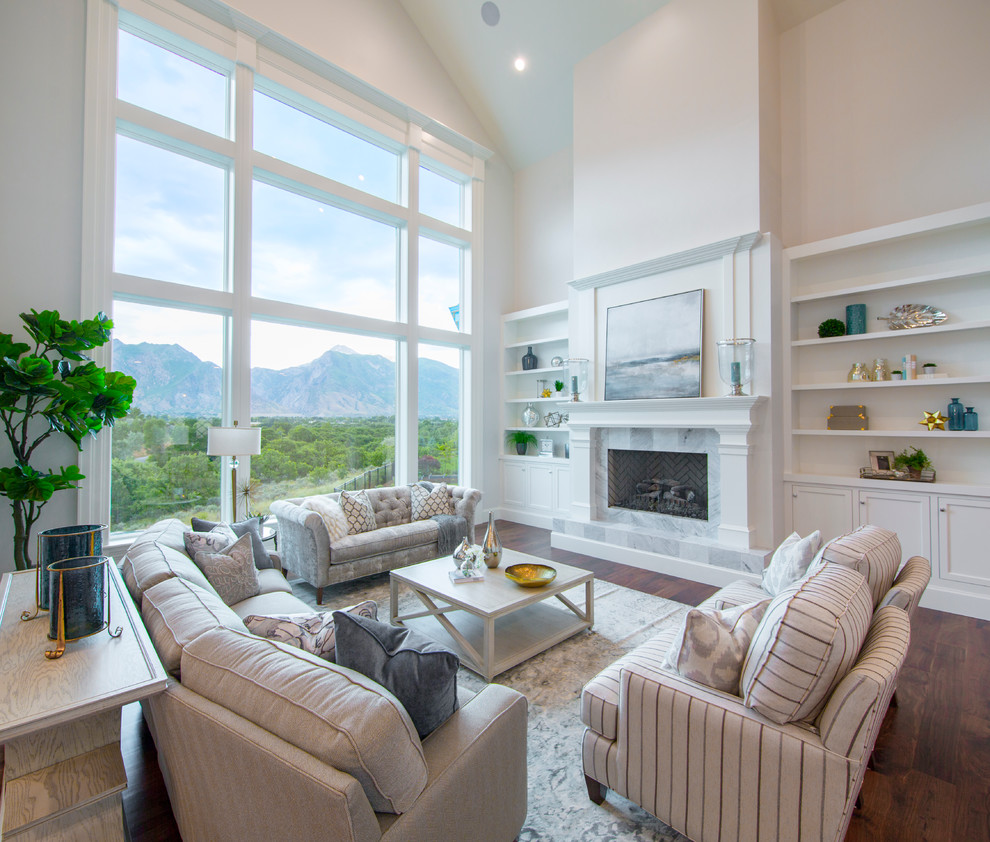 Inspiration for a large transitional open concept family room in Salt Lake City with a library, beige walls, dark hardwood floors, a standard fireplace, a stone fireplace surround and no tv.
