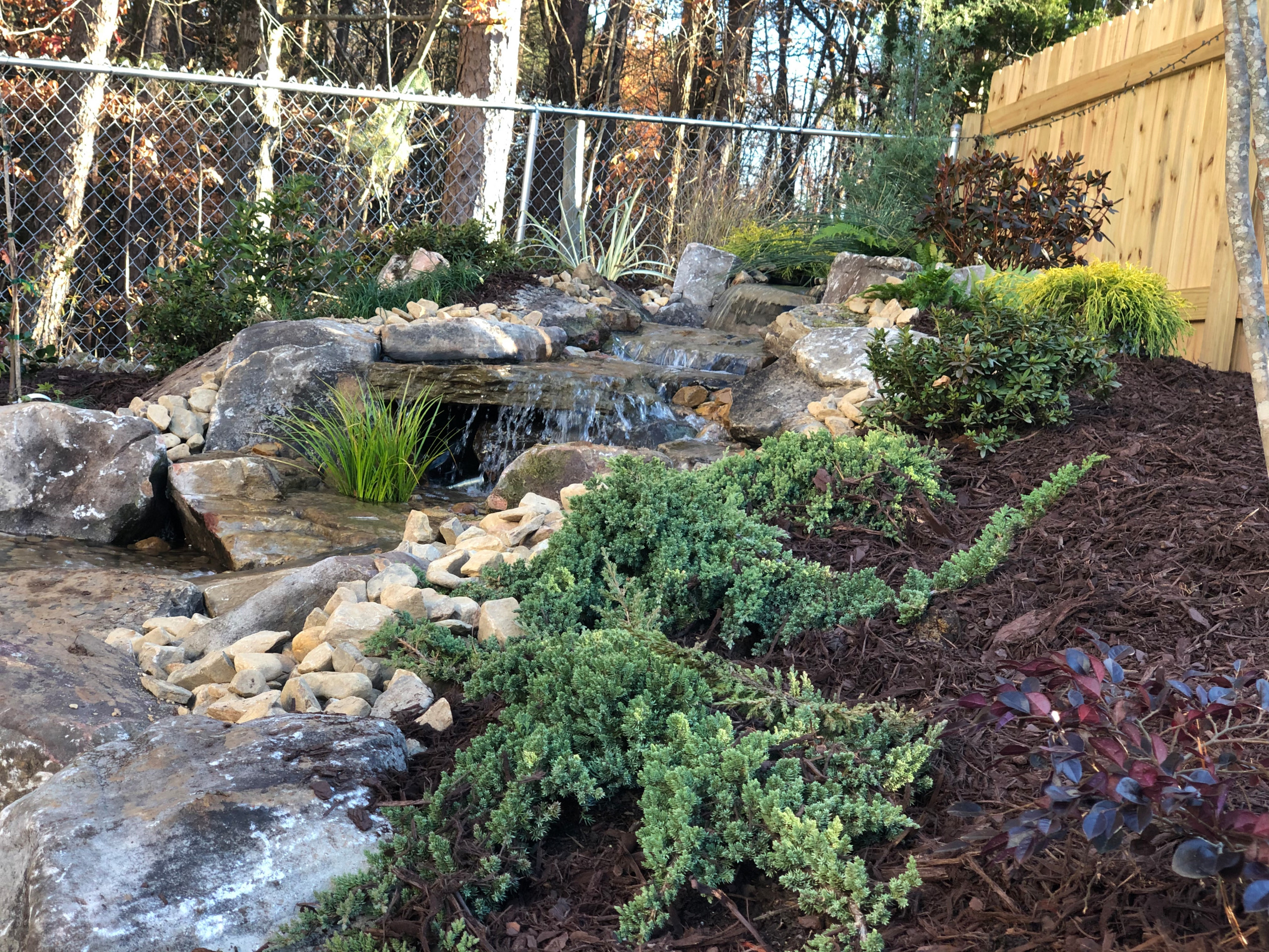 Backyard water feature, how to use the lay of the land to your advantage!