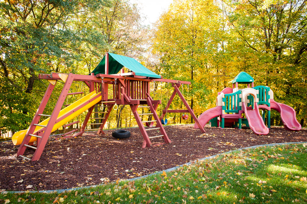 This is an example of a traditional garden in Minneapolis with with outdoor playset.
