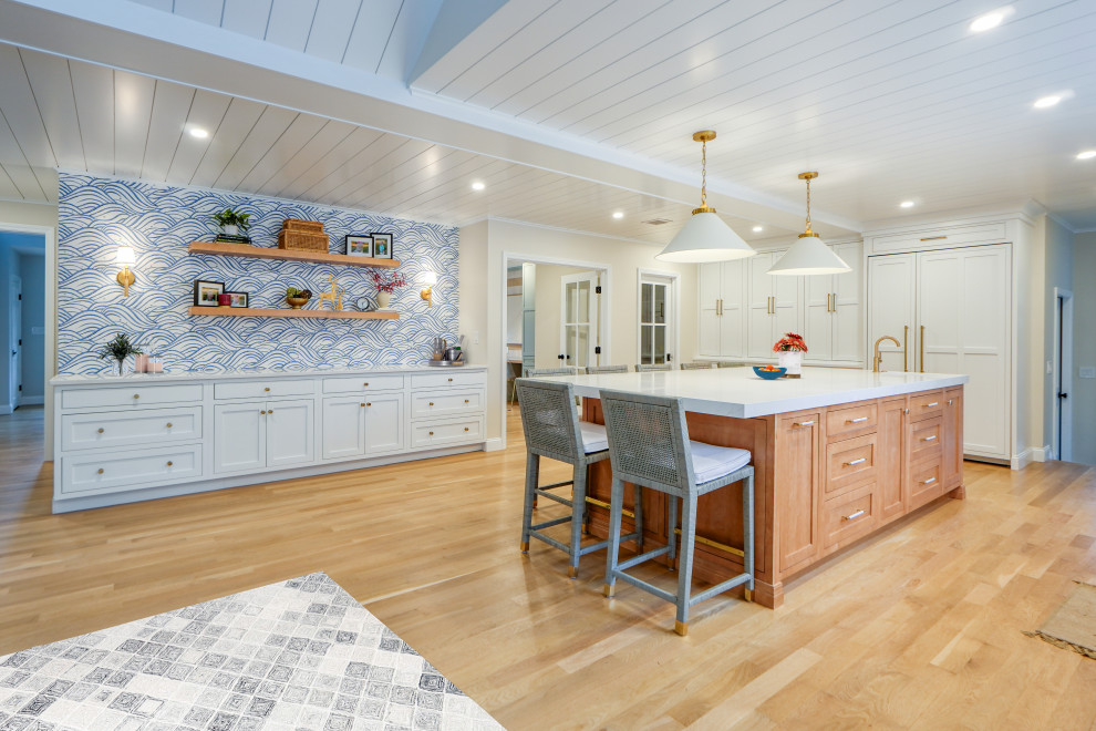 Example of a huge transitional light wood floor eat-in kitchen design in Providence with shaker cabinets, white cabinets, stainless steel appliances, an island and white countertops