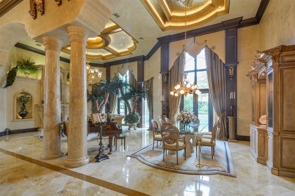 Mid-sized mediterranean open plan dining in Miami with yellow walls, marble floors, no fireplace and multi-coloured floor.