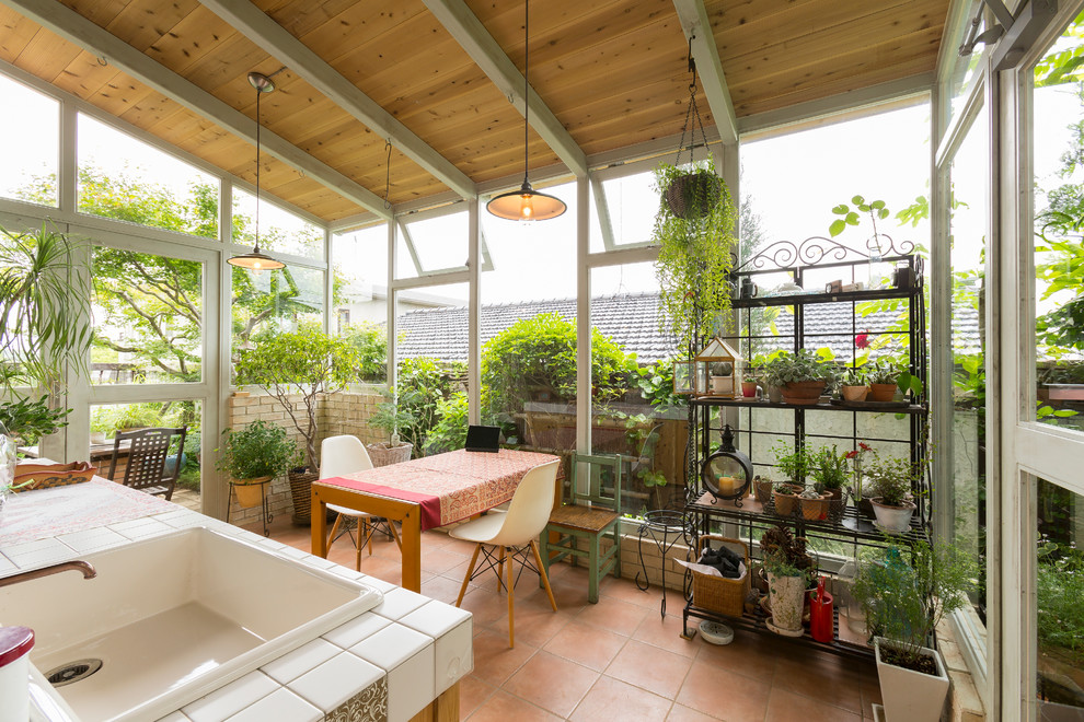 Design ideas for an asian sunroom in Other with a standard ceiling, terra-cotta floors and no fireplace.